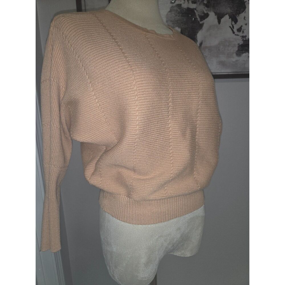 camel-colored knit sweater, dolman sleeve design with a ribbed vertical texture